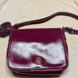 Tory Burch pink/burgundy patent leather bag.